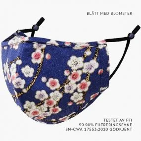 Blått munnbind med hvite blomster